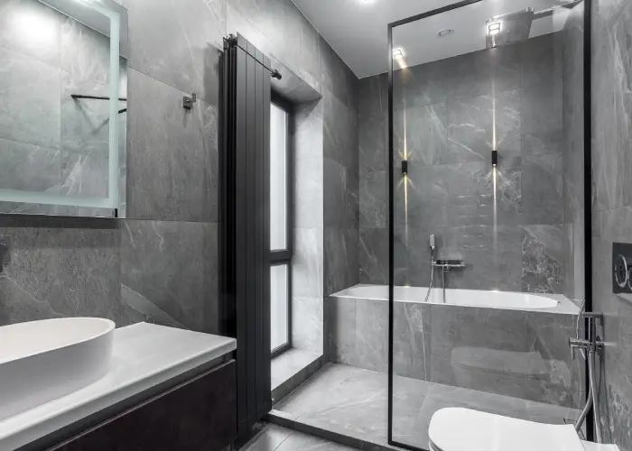grey vertical radiator in bathroom